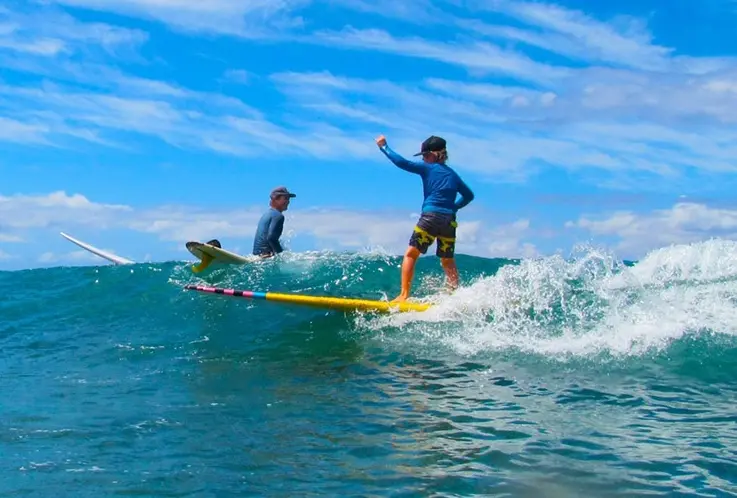 kid surfing in Maui